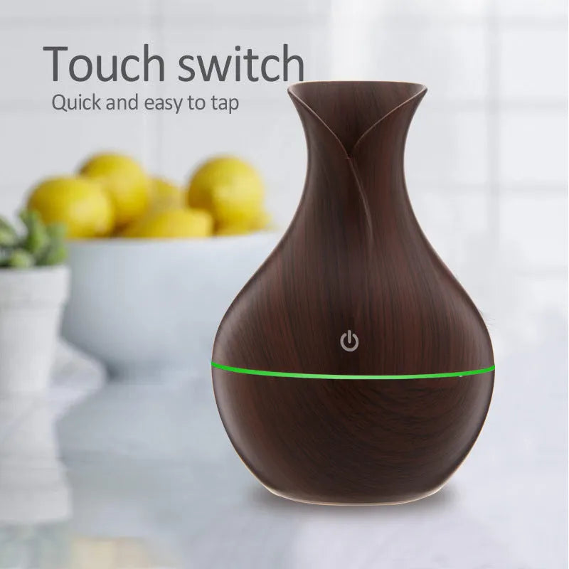 Small vase humidifier with 130ml water tank in Crackle Mahogany finish, USB powered, on a wooden desk