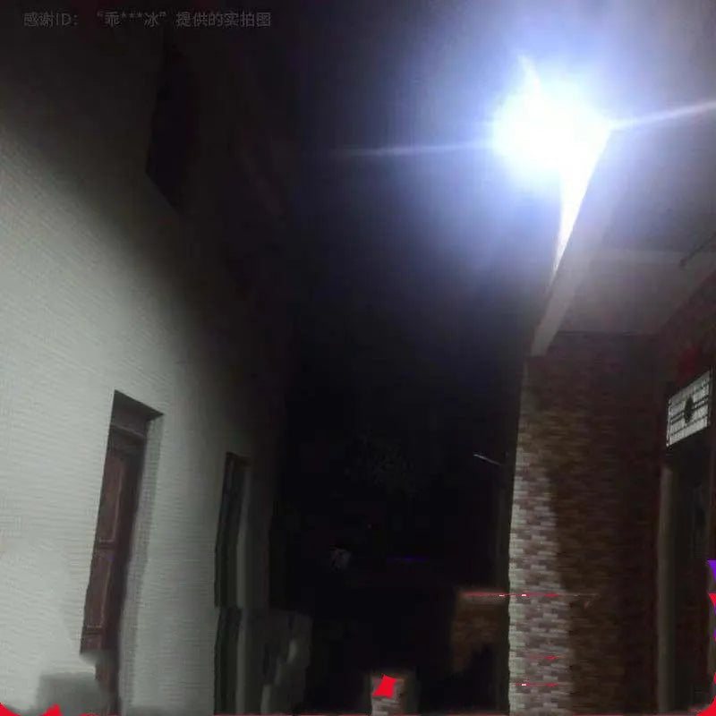 Black Cornucopia solar-powered LED flood light with remote control mounted on an outdoor wall