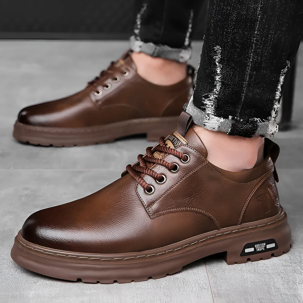 Men's black retro casual leather shoes with round toe and flat square heel on a white background