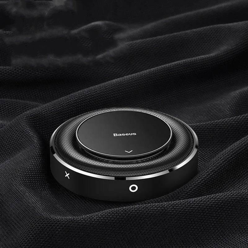 Round aluminium alloy car fragrance diffuser in black, red, and silver colours with four tablets.