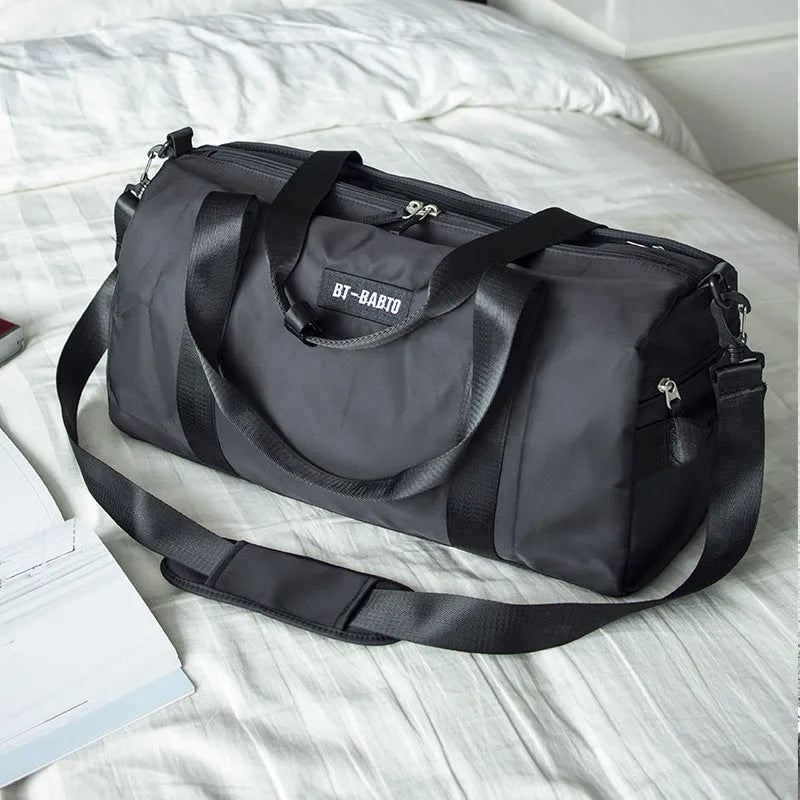 Beige casual sports bag with letter pattern design and contrast colour details.