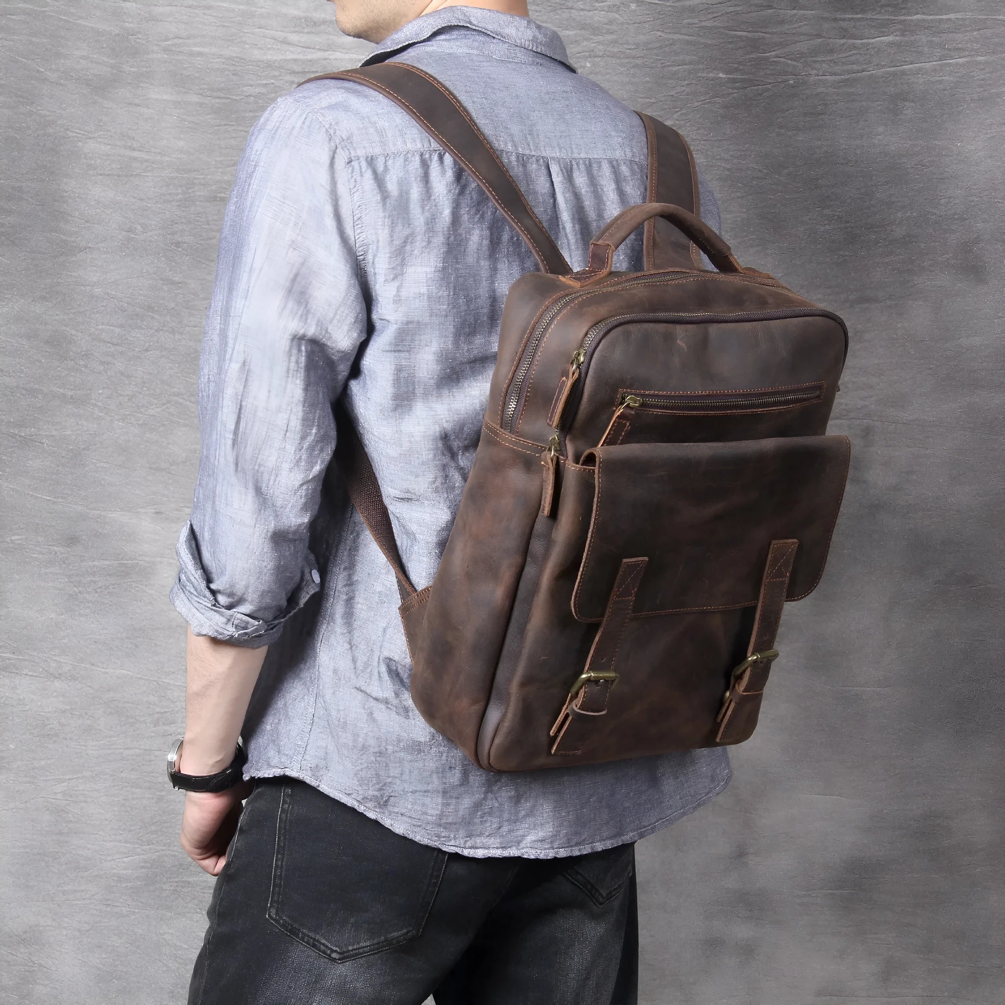 Dark coffee coloured handmade leather backpack with internal organiser compartments.