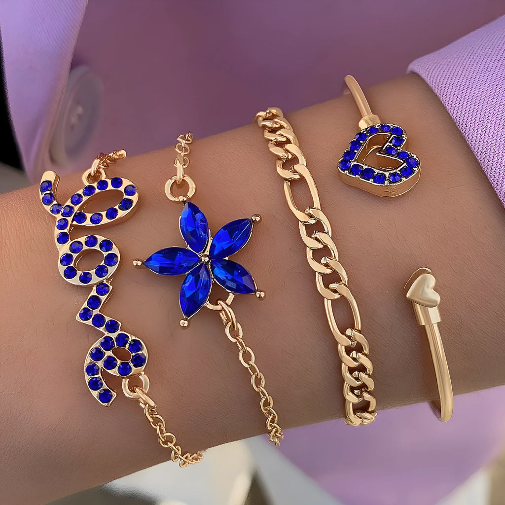 Four-piece blue and gold-tone bracelet set with heart, butterfly, and flower designs, rhinestone accents, alloy electroplated finish