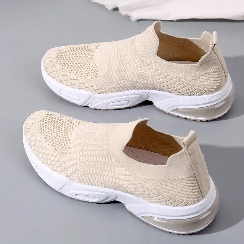 A pair of breathable mesh slip-on sock shoes with a PVC sole, shown in black colour.