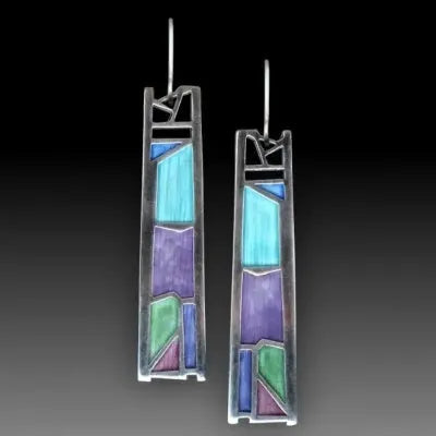 Silver coloured women's earrings with an irregular water drop shape made from alloy.