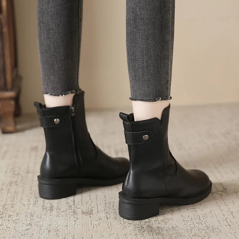 Black women's ankle boots with side zip and low round toe on rubber sole