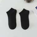 Men's solid colour low-cut polyester boat socks in assorted hues on a white background.