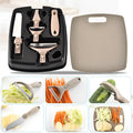 Green eight-piece stainless steel kitchen cutter set with peeler, knife, and integrated chopping board.