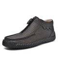 Men's black slip-on loafers with round toe and rubber sole on a white background.