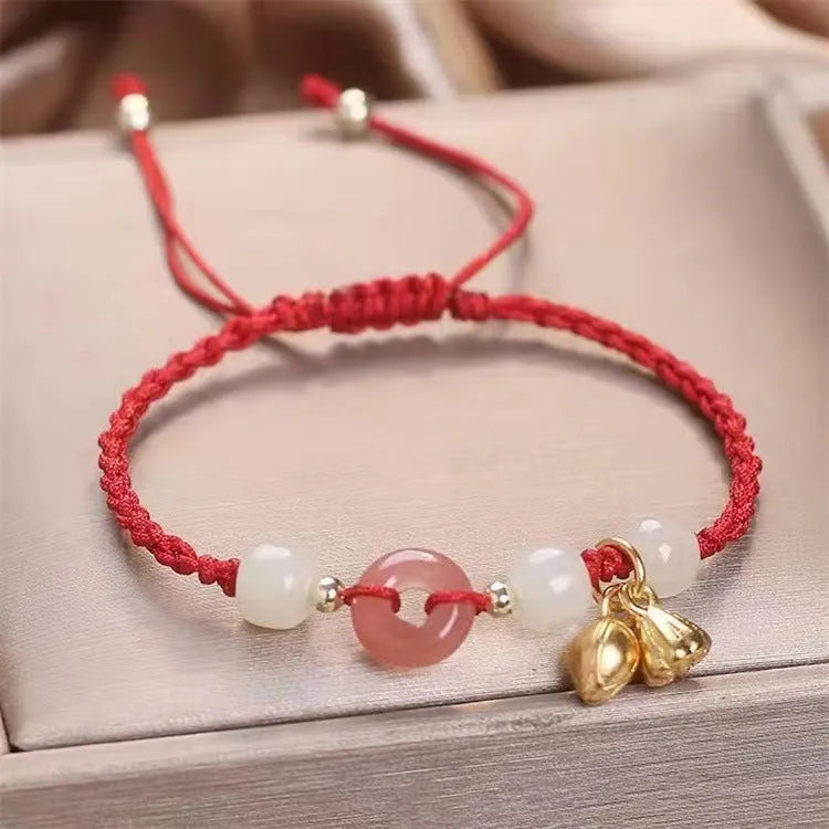 Women's Hetian jade bracelet with peace buckle charm, constellation detailing, and adjustable shihuan closures