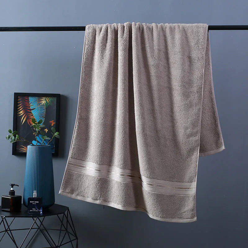Pure cotton bath towel set showing three pieces in blue colour with floral pattern detail