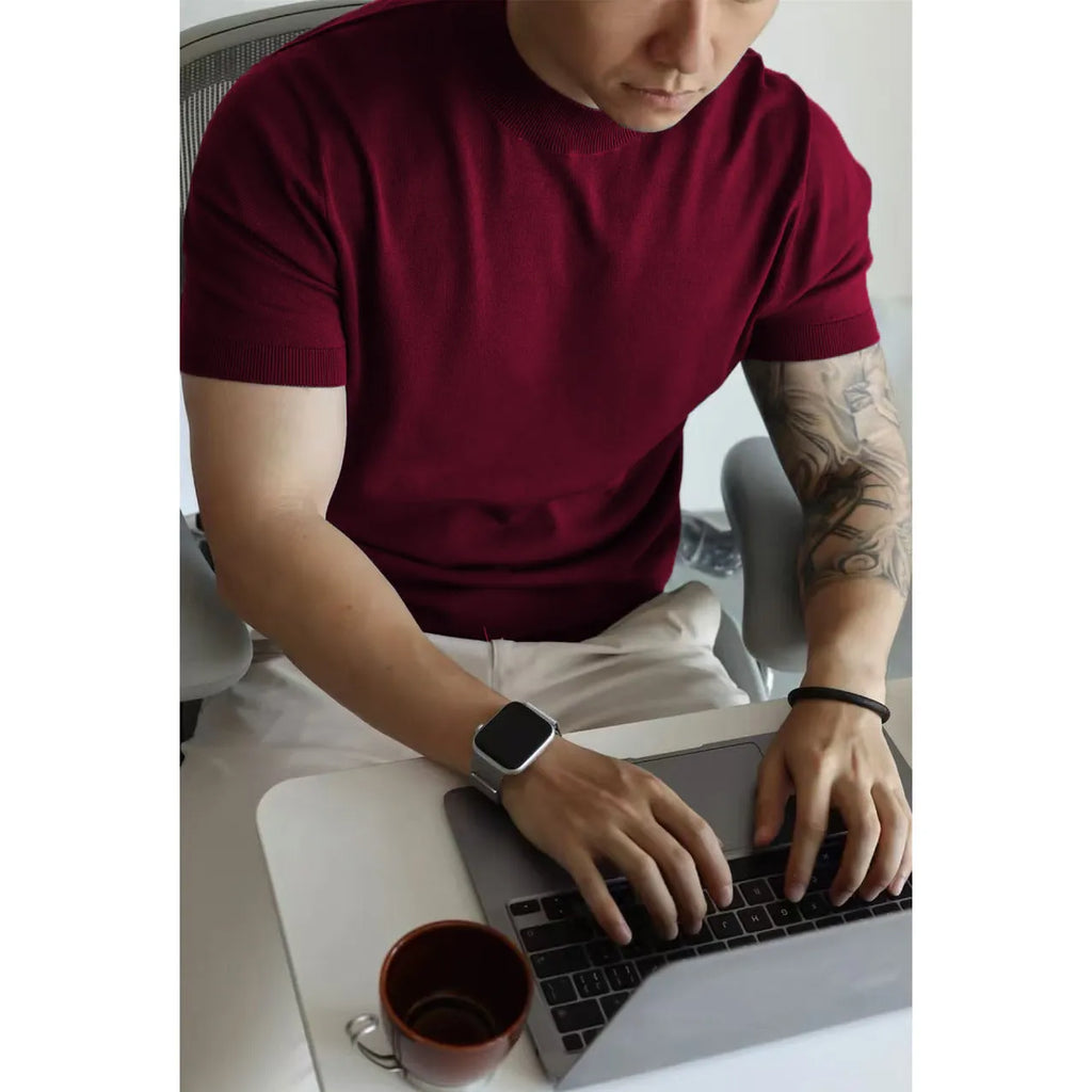 Men's slim-fit solid colour T-shirt on a hanger, shown in a wine red colour.