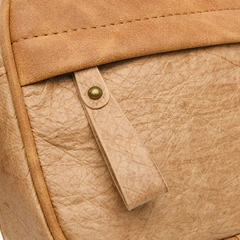 Men's waterproof paper crossbody bag in European and American retro style, shown in black, brown, and silver colour options