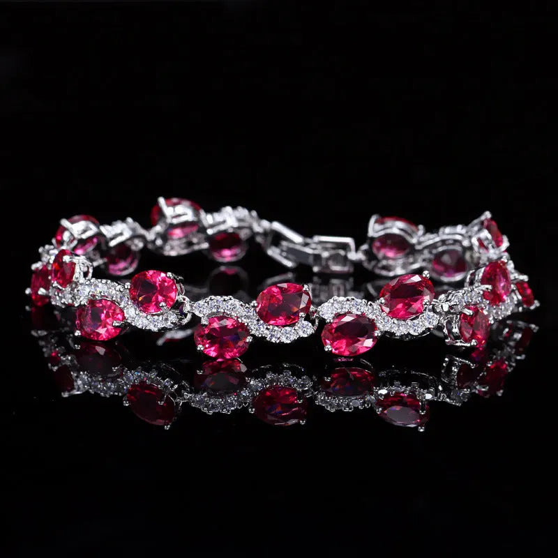 Copper gold electroplated bracelet with AAA+ zircon stones in geometric design measuring 18.4 cm length