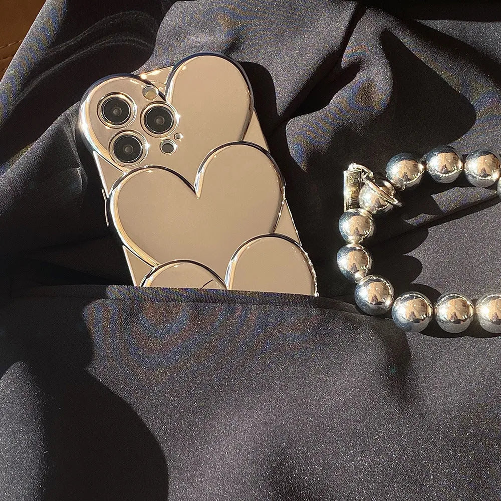 iPhone mobile phone case with shiny silver electroplated love design on a solid colour soft TPU back cover.