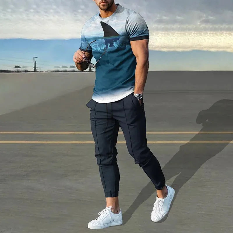 Men's short-sleeved printed pullover suit set with round neck T-shirt and matching trousers on a hanger.