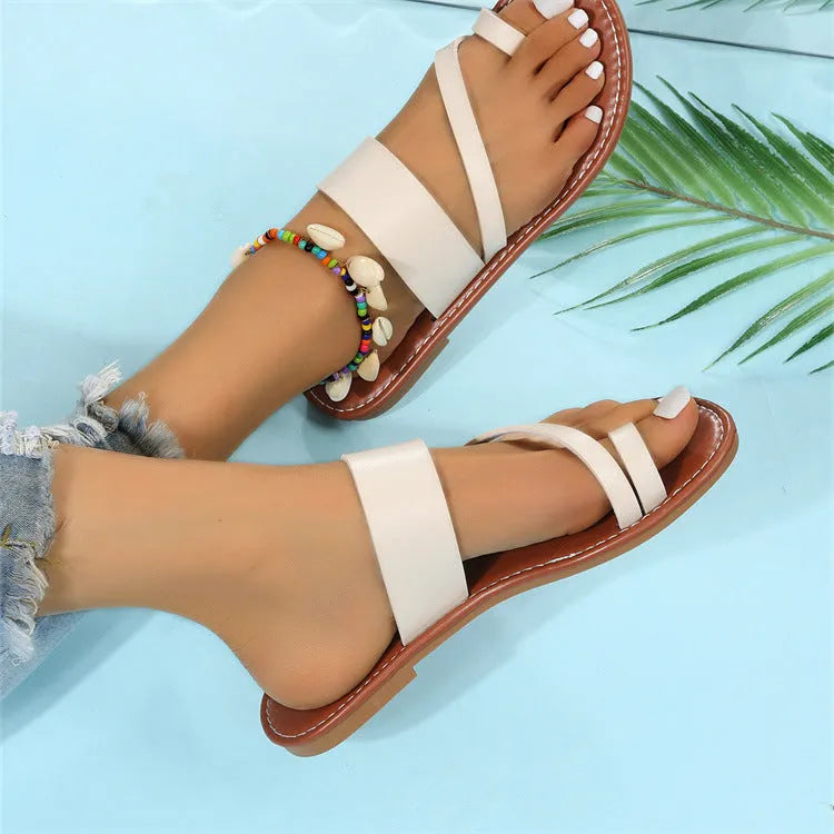 Women's flat thong sandals with artificial PU upper and rubber sole, solid colour, sizes 36-43