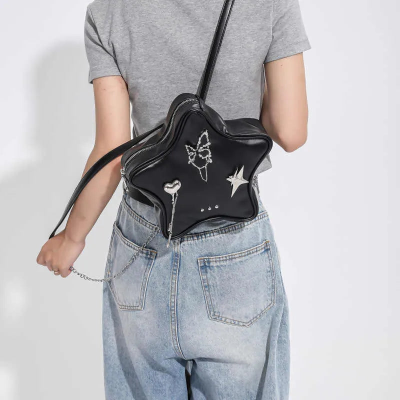 Soft black PU women's mini messenger bag worn as a backpack on a model.
