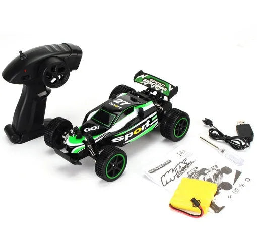 Blue 1:18 scale remote control off-road drift car with 2.4GHz remote on a grey surface.
