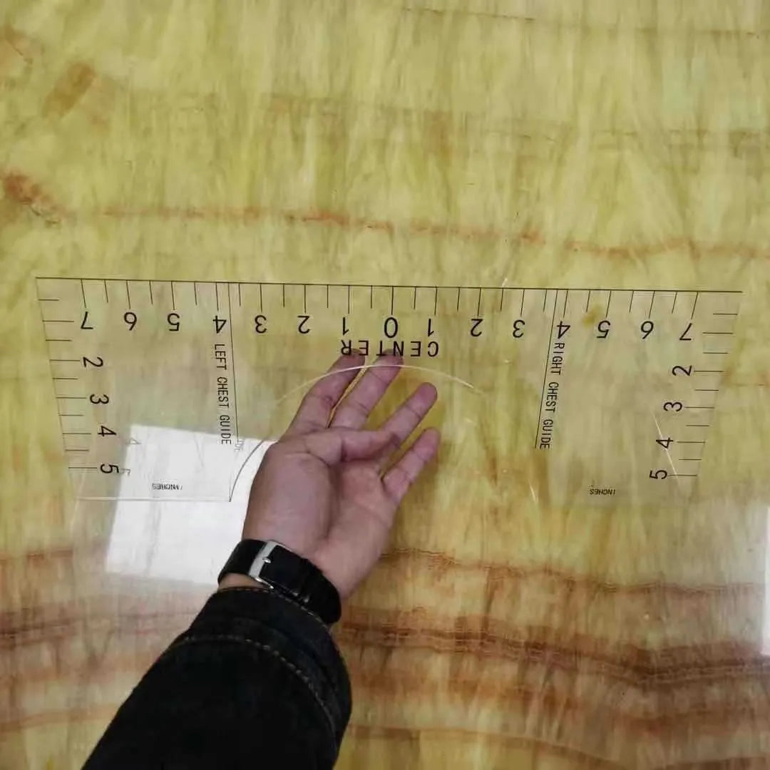 Transparent acrylic sewing ruler measuring 10 by 6 inches for T-shirt patch alignment