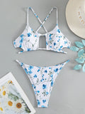 Women's floral swimsuit set with tie-neck triangle top and matching shorts