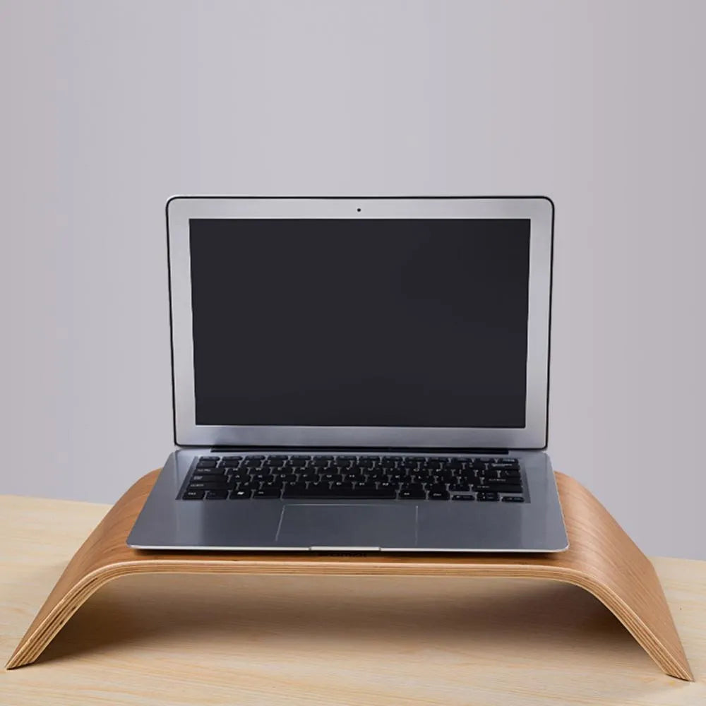 Walnut stability bracket laptop stand in bamboo leather colour, 23x51x9cm, on a desk