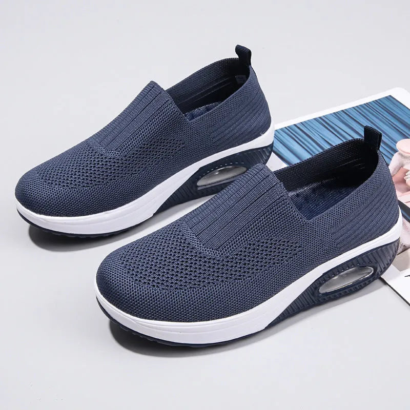 Women's mesh running shoes with air cushion sole in beige colour showing round toe and elastic lace design