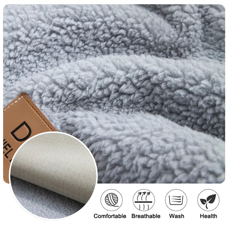 Solid colour plush sofa cover piece with anti-slip backing on a grey sofa