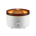 White simulated flame volcano humidifier and aroma diffuser with remote control on wooden surface