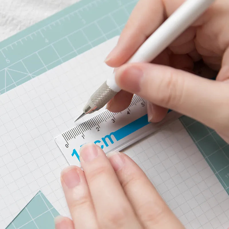 Art pen knife cutting board set with backing board, ruler, sharpener, and blade in choice of colours