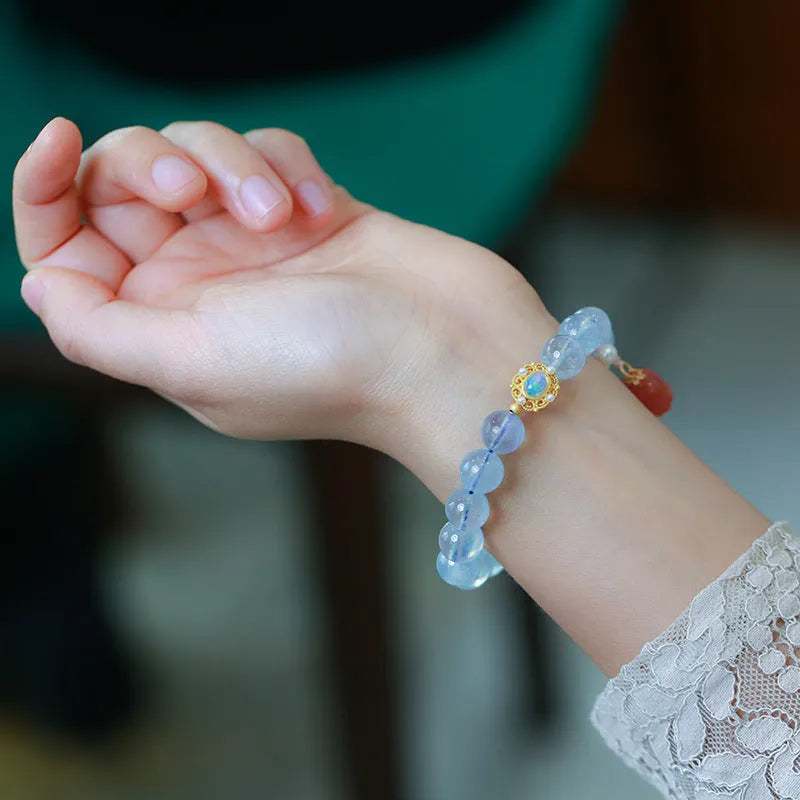 Aquamarine DIY bracelet for women with Fengjiu fox charm, showing pearl and crystal design options.