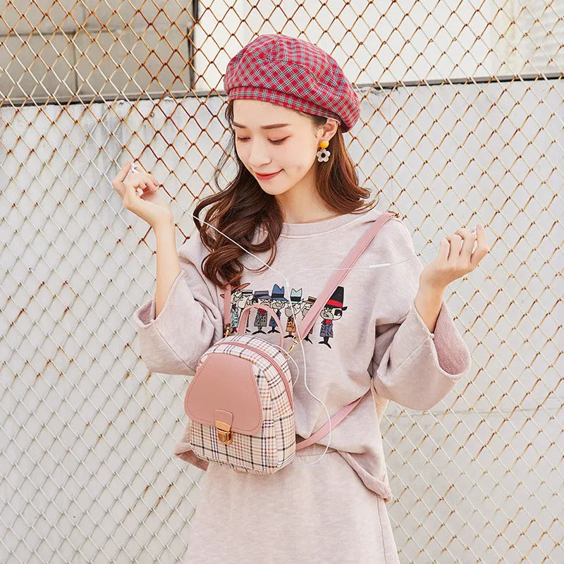 One shoulder diagonal phone bag in PU fabric shown in one of five colours: black, blue, brown, pink, or red.