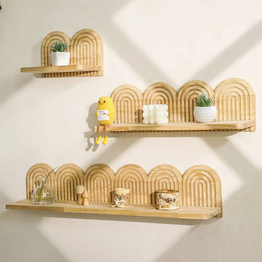 Solid wood multi-layer wall rack holding several flower pots for home decoration.