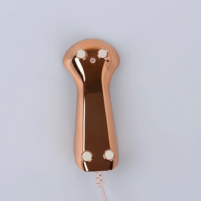 Electric face wash cleaner with pink silicone brush head on a light background