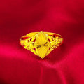 Adjustable gold-coloured brass floral ring with openwork design and textured diamond details.