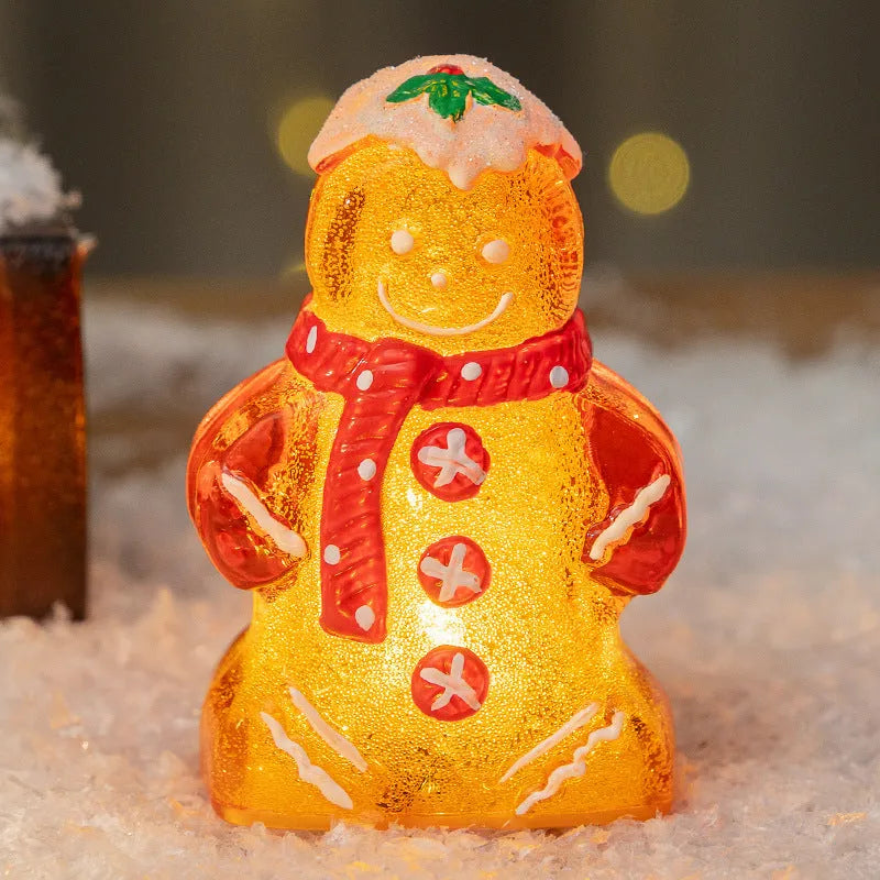 Glowing LED Christmas gingerbread man and snowman ornaments with removable scarves in different colours.