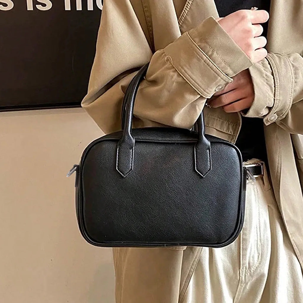 Retro small square PU leather messenger bag in black and coffee brown colours with a single adjustable strap.