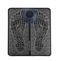 Leather foot massage cushions with a wireless remote control on a grey background.