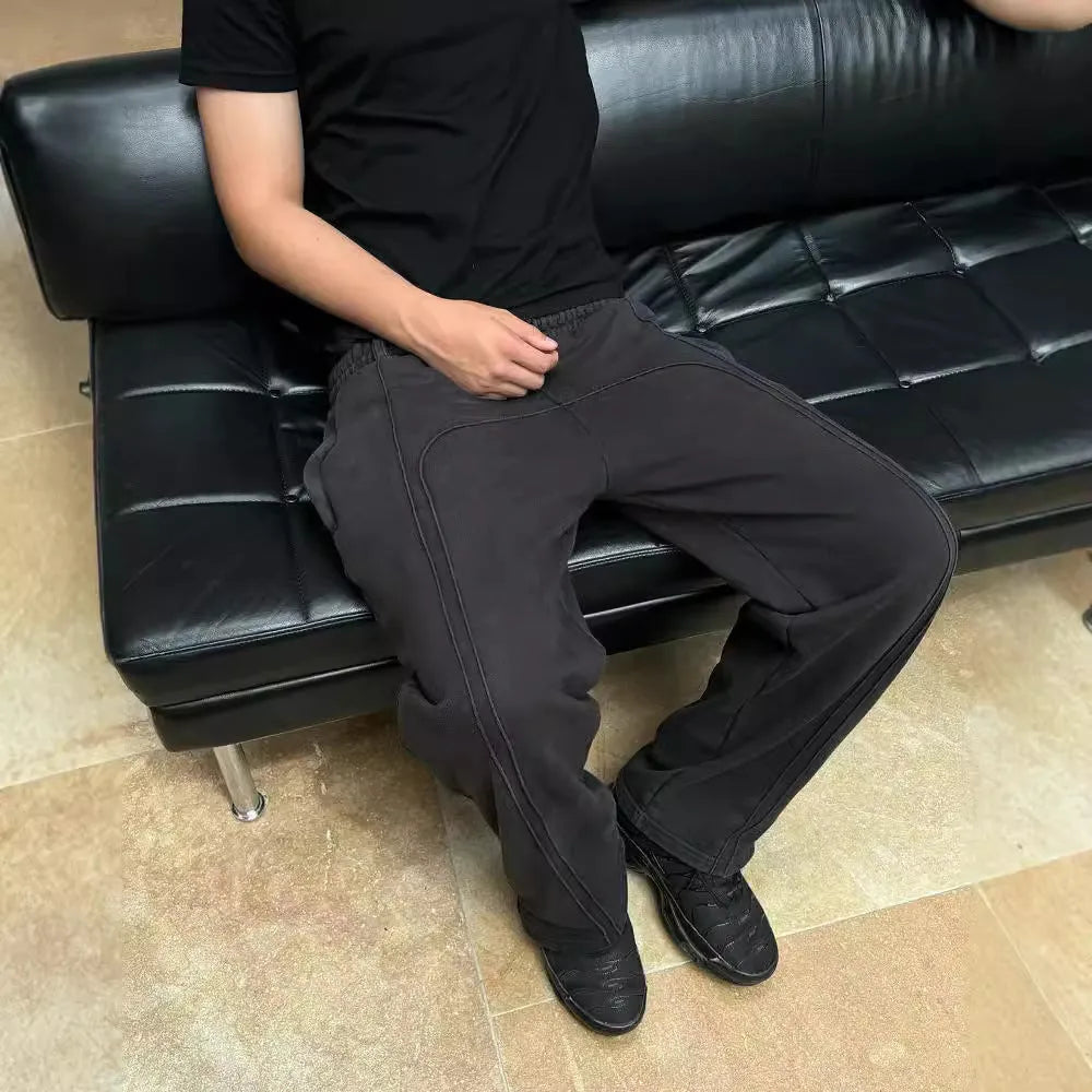 Men's loose fit cropped sweatpants with rope drawstring waist, available in black, gray, and green