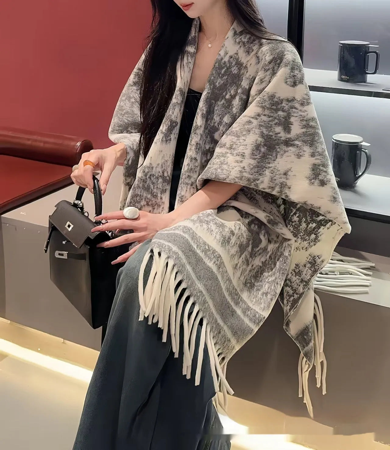 Women's free-size polyester scarf cape with tassel fringe in a choice of colours.
