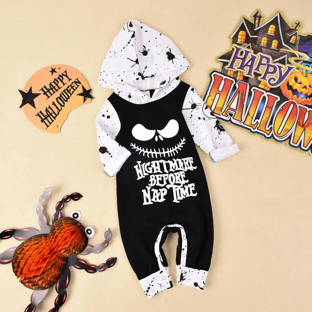Black cotton hooded Halloween romper for children with long sleeves on a hanger