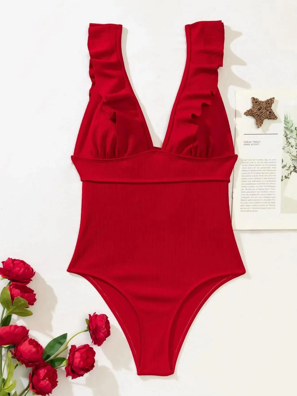 Women's black one-piece swimsuit with ruffled adjustable shoulder straps and lace back detail.