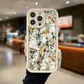 Ghost Flower frosted TPU phone case for Apple iPhone with built-in bracket, available in white, pink, green, and black