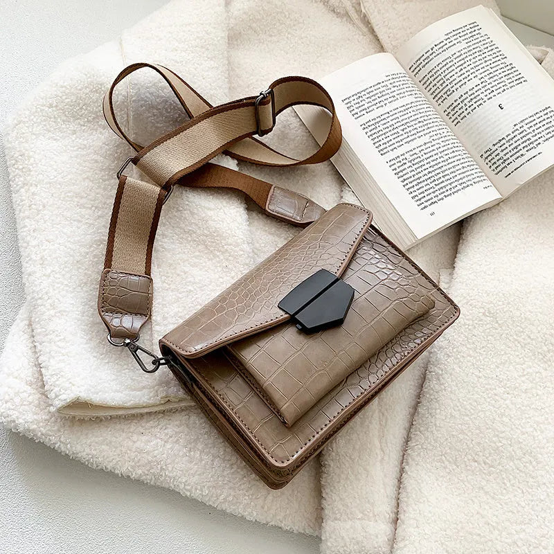 A PU fabric crossbody bag with an adjustable strap, shown in dark brown colour.