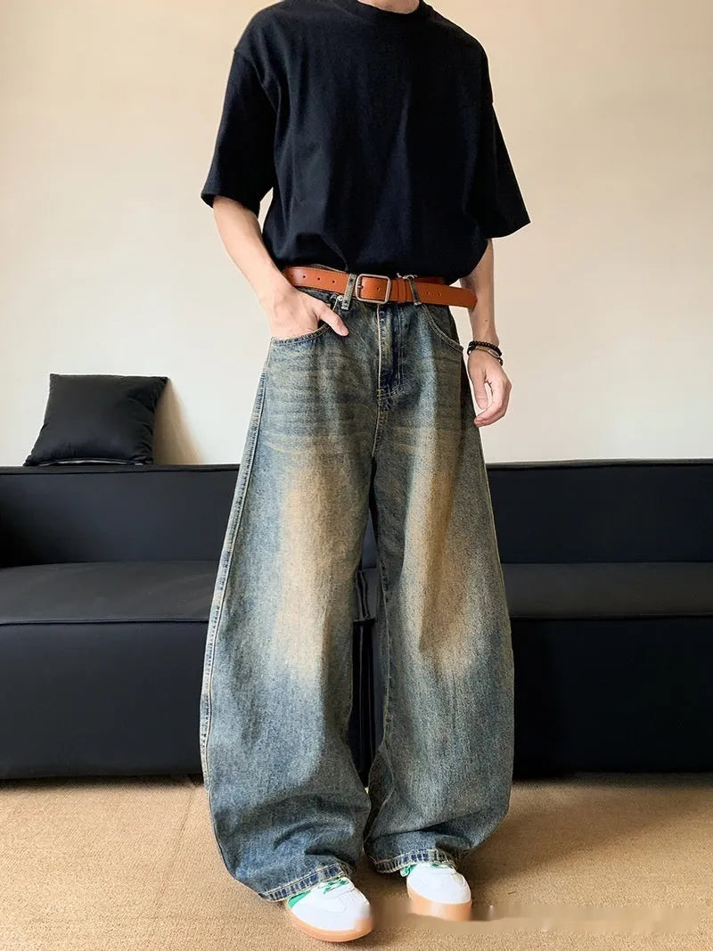 Men's distressed denim jeans in retro blue colour with wide-leg design and mid-waist fit