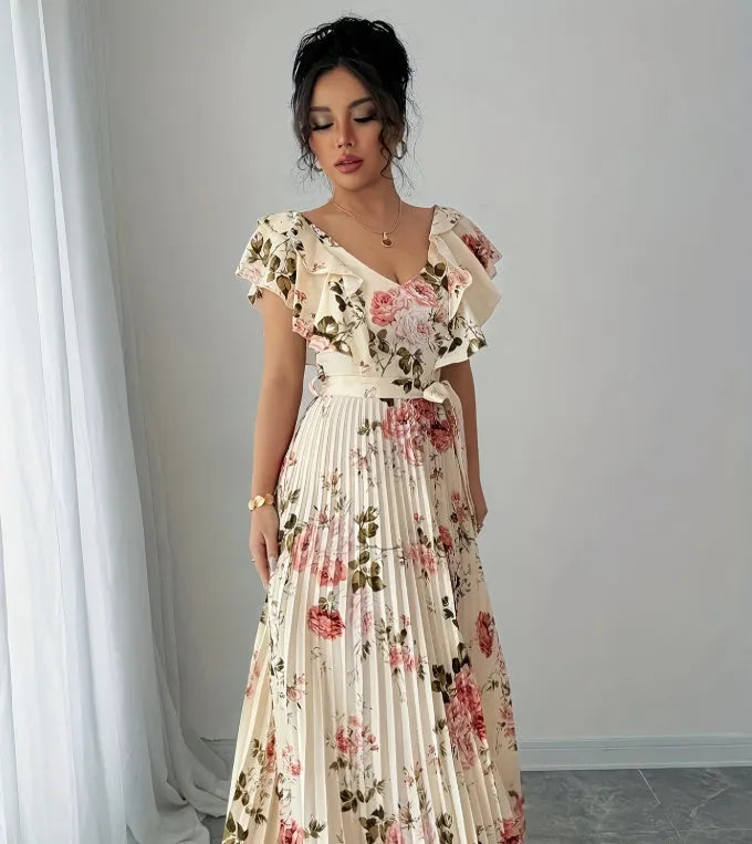 Apricot-coloured women's floral print dress with a V-neckline, ruffled short sleeves, and a flowing swing skirt.