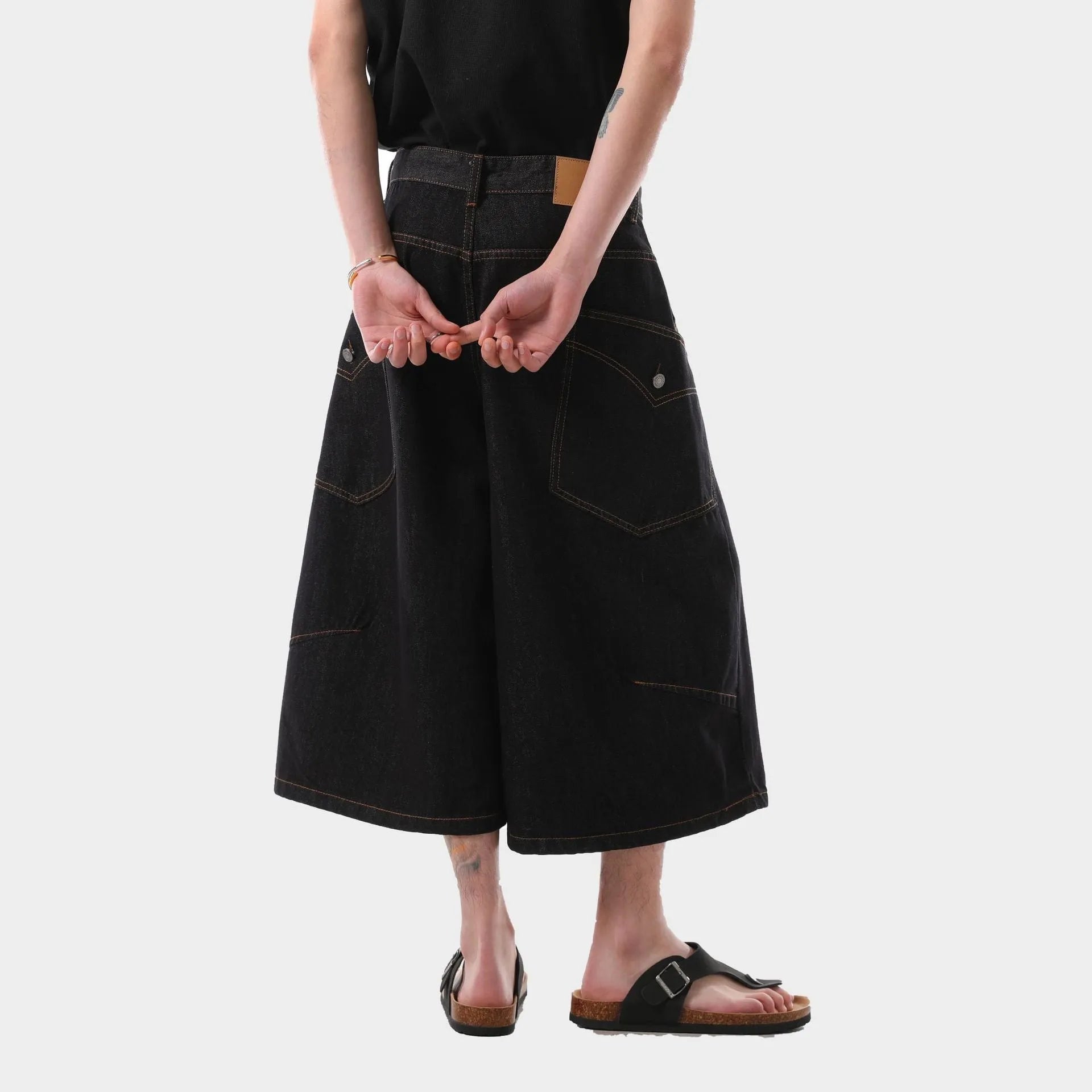 Men's black retro style cropped denim jeans with side pockets on a straight leg.