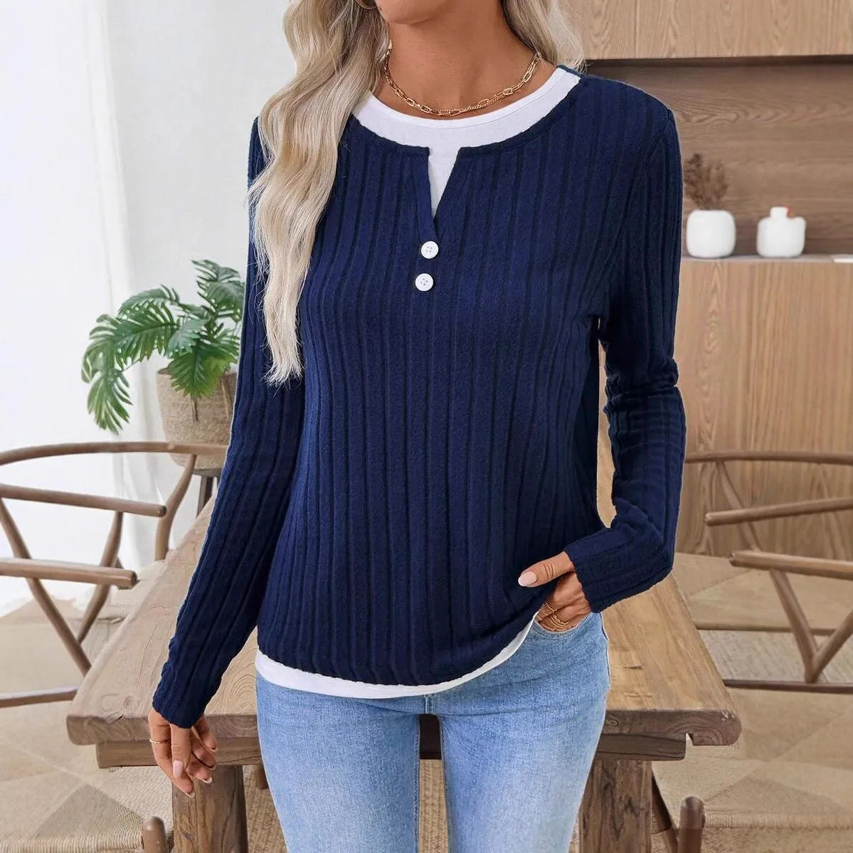 Women's solid colour button-front pullover sweater with a concave stripe texture pattern.