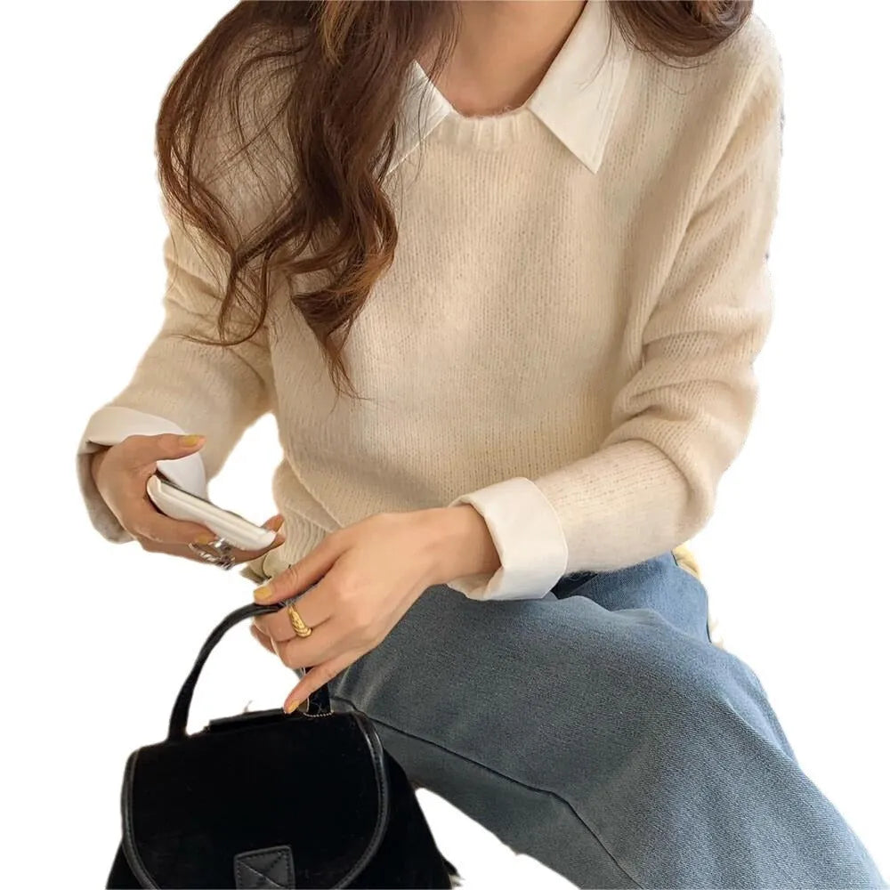 Women's loose knitwear top in navy blue with long sleeves and solid colour design