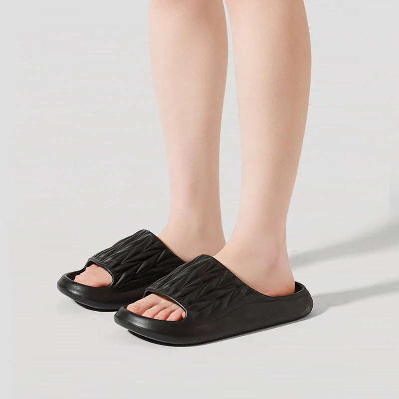 Leaf texture patterned EVA slippers for indoor household use, shown in various colours.